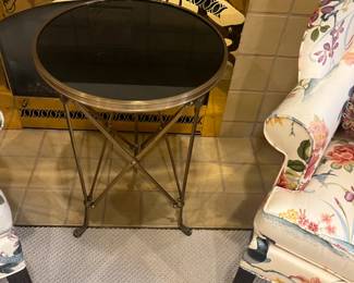 $600. Brass and black round heavy table made by global view. 17 inches deep by 26.25 inches high. Available for online purchase per the instructions on the sale details page, pickup is during in-person shopping hours.