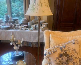 $280  A standing solid brass lamp with beautiful custom floral shade. 65 inches high to the finial.  Available for online purchase per the instructions on the sale details page, pickup is during in-person shopping hours.