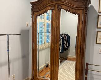$440. Antique mirrored front armoire. 48.25 inches wide by 18 inches deep by 94.75 inches high.  Available for online purchase per the instructions on the sale details page, pickup is during in-person shopping hours.
