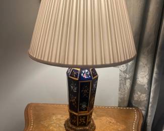 $360  A beautiful pair of navy porcelain painted lamps with three-way switches 24 inches high.  Available for online purchase per the instructions on the sale details page, pickup is during in-person shopping hours.