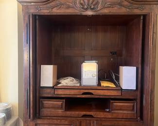 interior behind the upper doors that fold into the armoire completely.