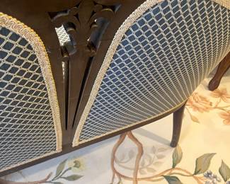 A view of the detailing on the back of the settee.