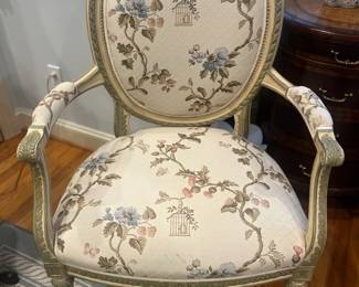 $360. Carved painted wood fauteuil upholstered  with Schumacher fabric.  chair measures 27.5 inches wide by 26 inches deep by 42 inches high. slight as found issue shown in following photo. Available for online purchase per the instructions on the sale details page, pickup is during in-person shopping hours.