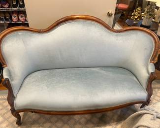 $420. Antique blue velvet sofa, 67 inches wide by 28"h. 
 Available for online purchase per the instructions on the sale details page, pickup is during in-person shopping hours.