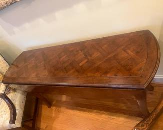 $1200. The Sterling Collection custom drop leaf console table.  Beauty and a workhorse for any home.  Two drop leaves make this a  perfect table for daily use or to pull out when you need an  extra option.  as shown it is 60 inches wide by 18.5 inches deep by 29.5 inches high. Each leaf pops up and adds an additional 7 1/2 inches on either side.  Available for online purchase per the instructions on the sale details page, pickup is during in-person shopping hours.