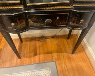 Close of view of the detail painting on the front of the cabinet   