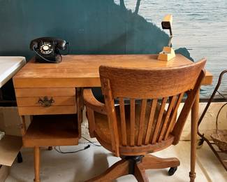 Vintage desk, rotary phone, lamp