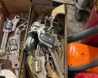 Numerous Cap Guns and Holsters