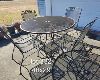Iron patio table set with dogwood motif