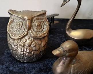 Brass owl, ducks, swan and airplane