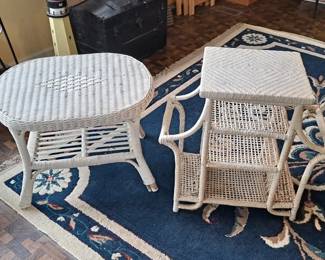 Wicker side tables and large blue area rug