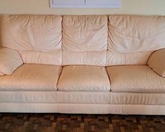 Pale yellow leather sofa