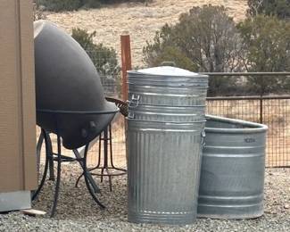 Trash cans, cowboy tub, water barrel