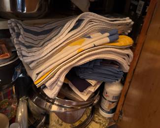 Lots of pots n pans and kitchen linens