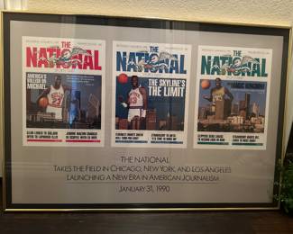 framed display of three covers of "The National" sports newspaper from January 31, 1990

The left cover features Michael Jordan with the headline "America's Bullish on Michael".

The center cover also features Jordan with the headline "The Skyline's the Limit".

The right cover features Magic Johnson with the headline "Magic Kingdom".

The display commemorates the launch of "The National" in Chicago, New York, and Los Angeles.
