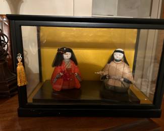 Chinese dolls in glass case 