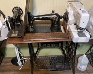 two singer sewing machines, and Handi quilter HQ, stitch 510