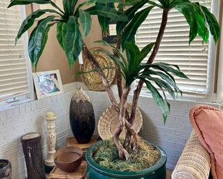 oversized artificial plant in heavy pottery planter
