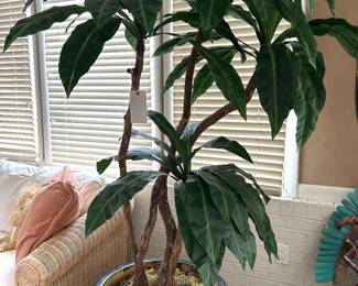 oversized artificial plant in heavy pottery planter