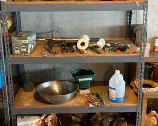 Multiple four level steel shelving units
