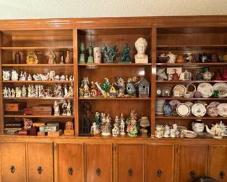 Antique figurines of various size. Decorative plates, teacups, and bookends.