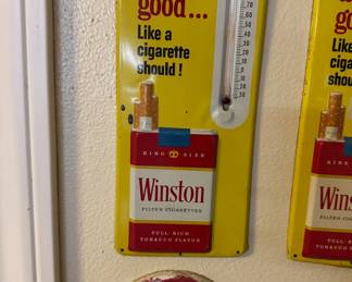 "Winston tastes good" thermometer by Winston Cigarettes.