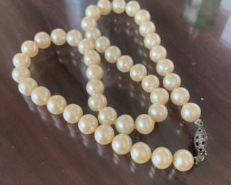 Pearls closely knotted with sterling clasp