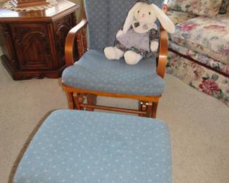 Cute glider chair with foot rest.