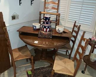 Wonderful maple pedestal table & ladder-back chairs. Believed to be Nichols & Stone.