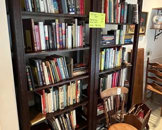 Matched pair of tall bookcases - full of books