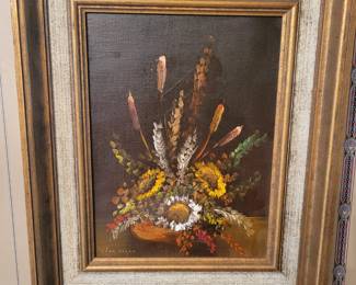 A wonderful still life oil on canvas signed Van Doren. This magnificent realist painting depicts a beautiful highly detailed bouquet of flowers in a vase.