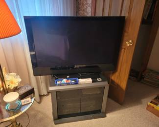 Flat screen television and stand.