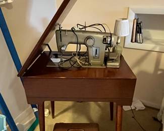 Vintage Kenmore sewing machine with cabinet.....