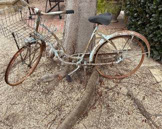 Rusty bike yard art 100.00