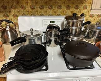 Here are some GREAT items! A very nice collection of cast iron and a nice set of Revere Ware Pots and Pans!  (Stove is not for sale)
