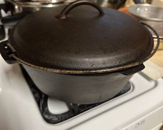 A very nice covered cast iron Dutch oven! 