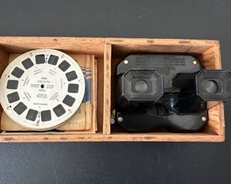 This is a sweet Vintage View Master in a cool wooden box with dozens of reels!