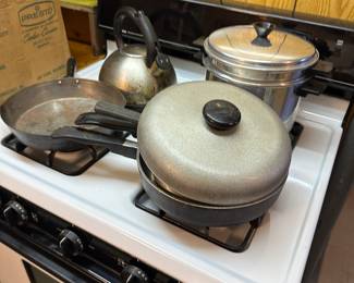 The basement stove isn’t for sale, but all the vintage pots and pans are! Too many to photograph! 