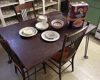 Nice vintage table and four wooden chairs! 