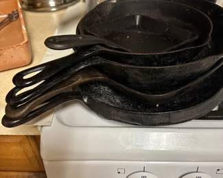 Five cast iron frying pans of various sizes! 