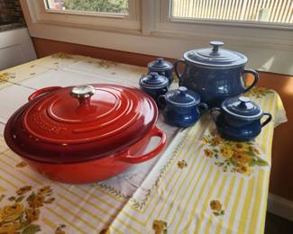 Le Creuset huge red Dutch ovens
Blue soup pot/bean pot and 4 matching lidded bowls
