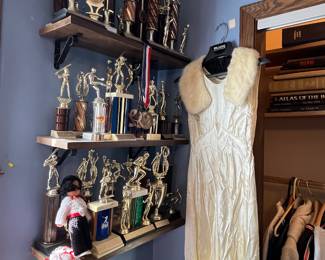 Trophies and vintage wedding gown