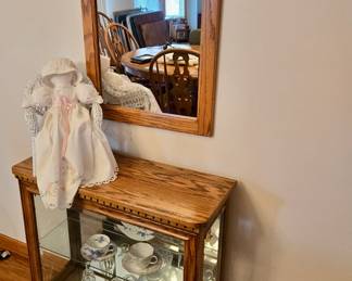 Nice Small 2-Shelf Oak Display Cabinet; Tea Cups & Saucers; Oak Framed Wall Mirror; Decorative Doll made from Vintage Linens; Wicker Doll Chair; Family Sign; Assorted Crystal & Molded Glass
