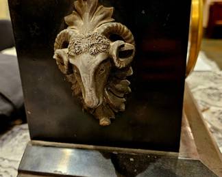 Close up of clock sides, rams head handles