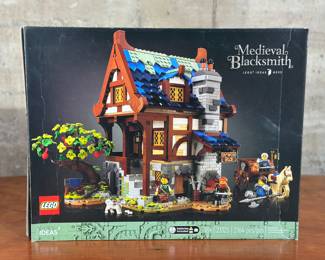 An adult-owned (built-once) Lego Ideas #033, Medieval Blacksmith set. Confirmed as a complete set, guaranteed by Salem Auction House with all the original packaging. Step back in time with the 21325 Medieval Blacksmith! This set masterfully recreates the charm and craftsmanship of a bygone era, perfect for history buffs and builders alike.