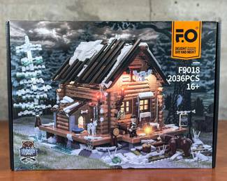 A sealed Funwhole Hunting Cabin set. With 2036 pieces, the Hunting Cabin is a must-have for nature enthusiasts, architecture aficionados, and passionate brick builders. Embodying the rustic charm of a wooden cabin and a cozy mountain retreat, this set delivers an unmatched building experience that captures the essence of outdoor living. F9018