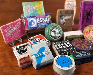 A wonderful collection of vintage surf wax from around the world. Some makers include DAY GLO, SUPER SHRED, UNDU-WAX, Hooter’s Surf Wax, Long Ryders Surfwax, Wavy Wax, Rat Cheese, & more. Some of these bars are from Southern California, New England, and Puerto Rico. Twenty bars in total, all sealed.