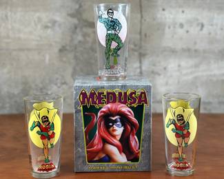 A limited edition collectible Medusa bust designed by Randy Bowen for Bowen Designs, edition 1708/5000 & three collectible vintage Batman themed drinking glasses. Bowen Designs is a company dealing in the creation and sale of entertainment-based collectible statues. Most Bowen products released thus far are based on Marvel Comics characters, but products based on independent comics and movies have also been created.