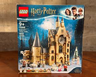 An adult-owned (built-once) Lego Harry Potter Hogwarts Clock Tower set. Confirmed as a complete set, guaranteed by Salem Auction House with all the original packaging. Transport fans of Harry Potter LEGO sets aged 9 and over to a magical world inside the Hogwarts Castle Clock Tower. With 8 minifigures and iconic locations from Harry Potter and the Prisoner of Azkaban and Harry Potter and the Goblet of Fire, kids will immerse themselves in a world of imaginative play. Whether visiting Dumbledore’s office or attending a Defense Against the Dark Arts lesson, traveling through time by resetting the tower clock or unwinding at the Yule Ball by operating the moving ‘dance’ function… once they enter the Hogwarts Clock Tower, they’ll never want to leave!