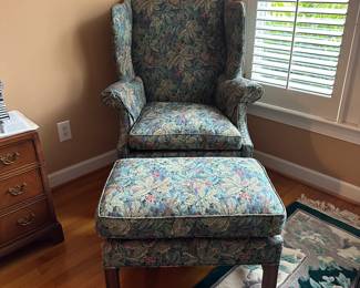C37- $75. Southwood Floral Side Chair and Ottoman. Chair measures  34" wide x 32" deep x 44" tall. 